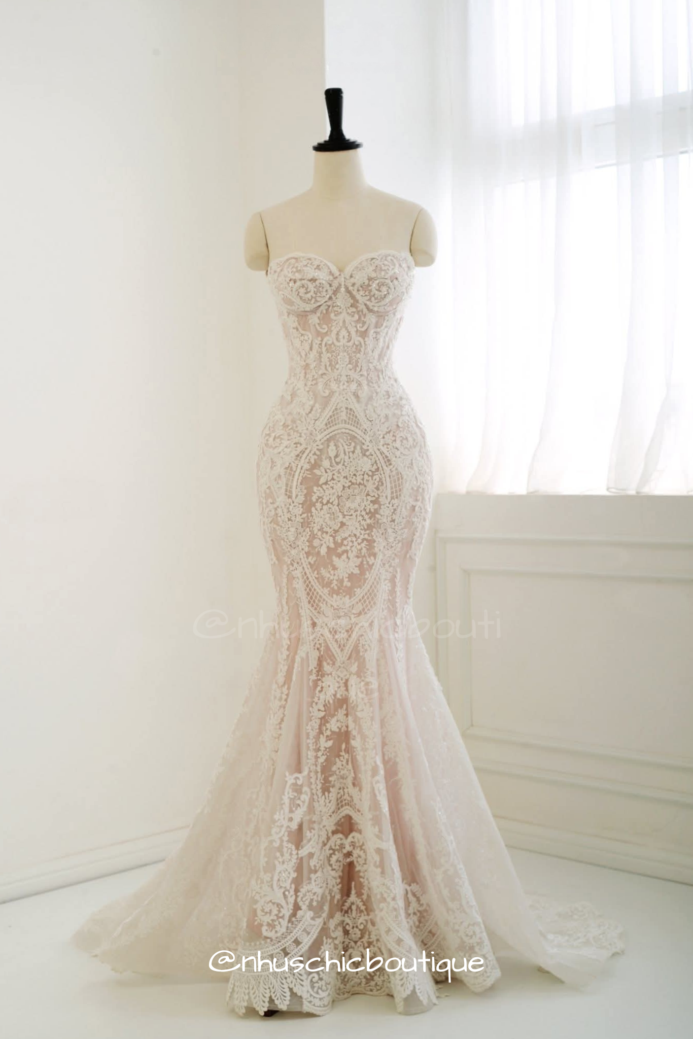Form-fitting lace mermaid wedding dress from Nhuschicboutique featuring a strapless sweetheart bodice, unlined corset detailing, and intricate all-over floral lace embroidery.