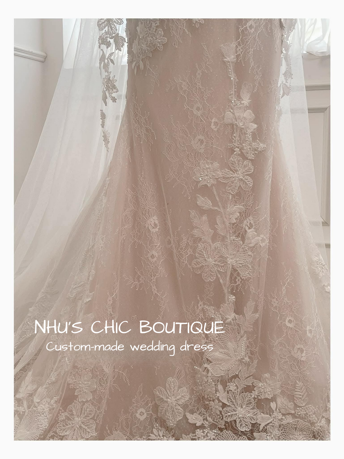 Close-up of a custom-made wedding dress with lace details, branded 'NHU'S CHIC BOUTIQUE'.