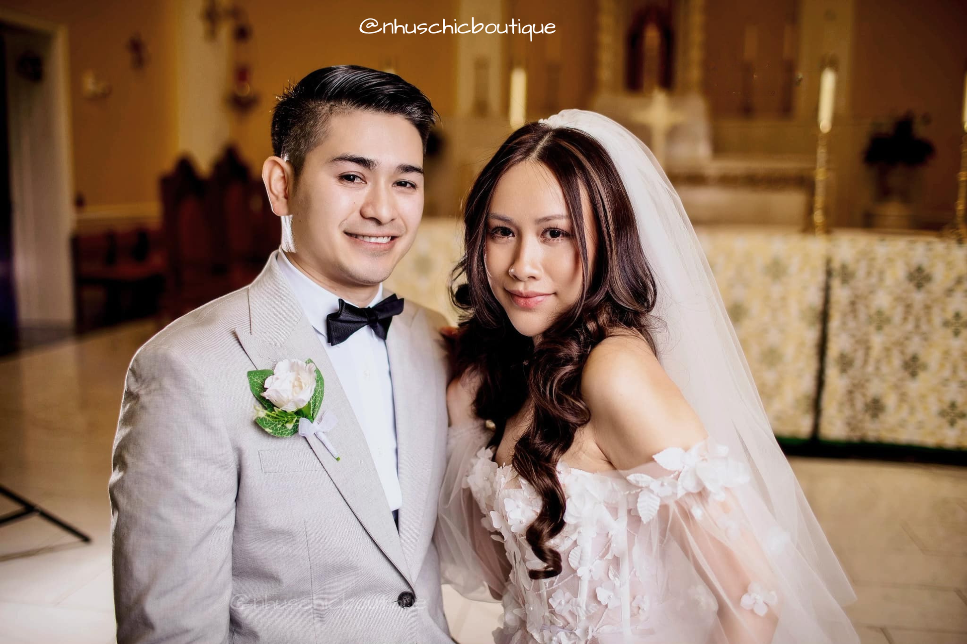 Alice Dress by Nhu's Chic Boutique - Whimsical wedding dress with 3D leaf appliqués and corset bodice worn by a bride.