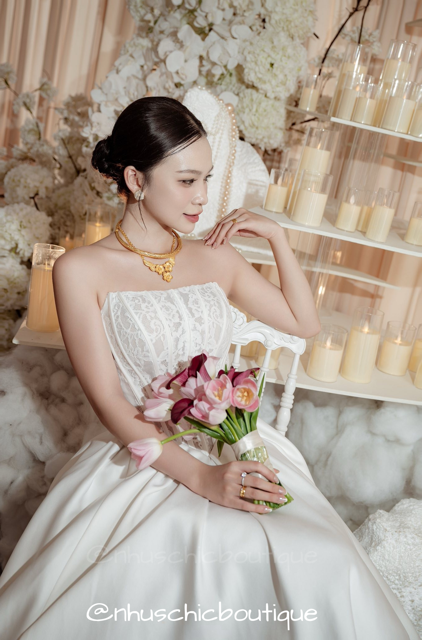 Close-up of the Sophia bridal gown's exposed boning lace bodice and straight-across neckline.