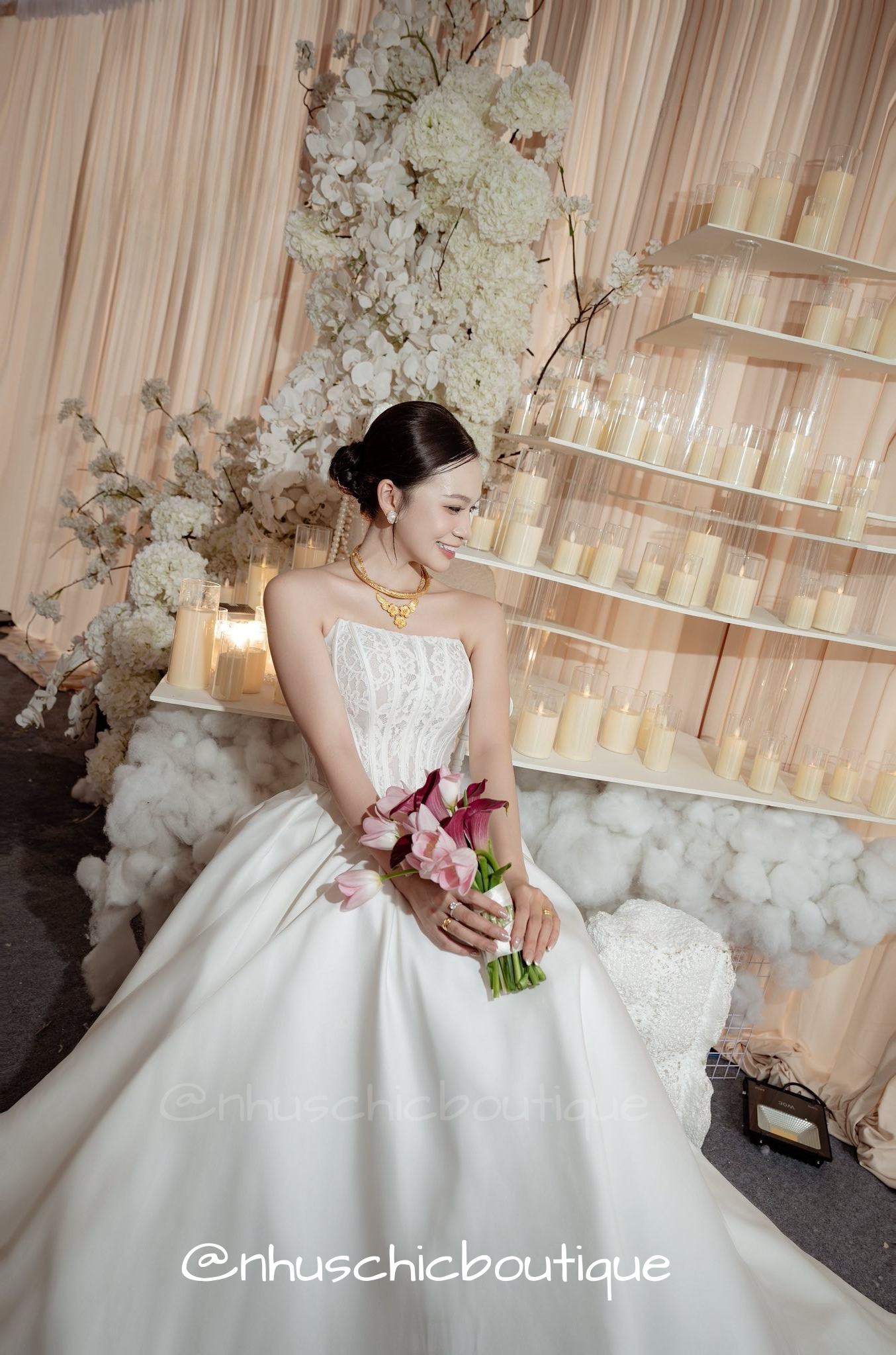 Full-length shot of the Sophia ballgown showing the dramatic pleating and structured satin fabric.
