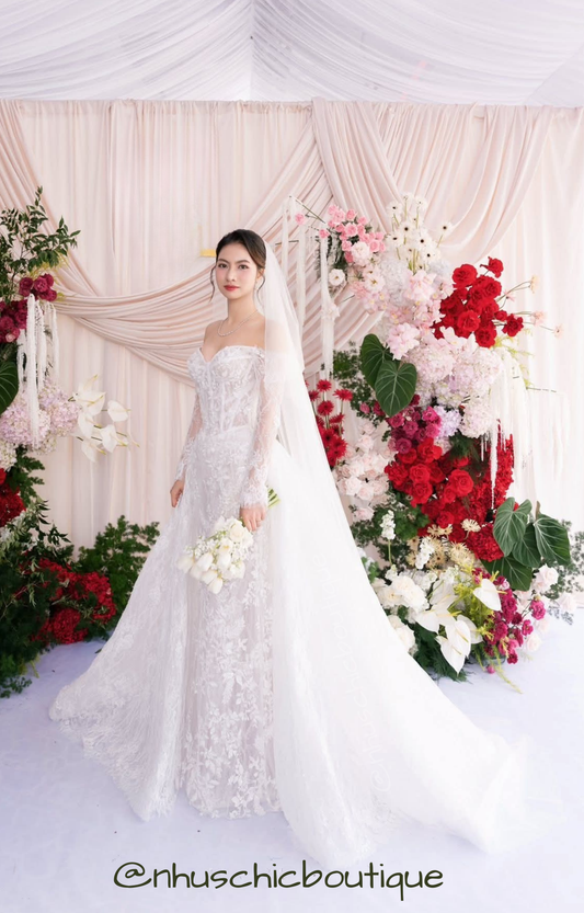 Japanese bride in "Yume-Hana" off-shoulder lace wedding dress holding white tulips.