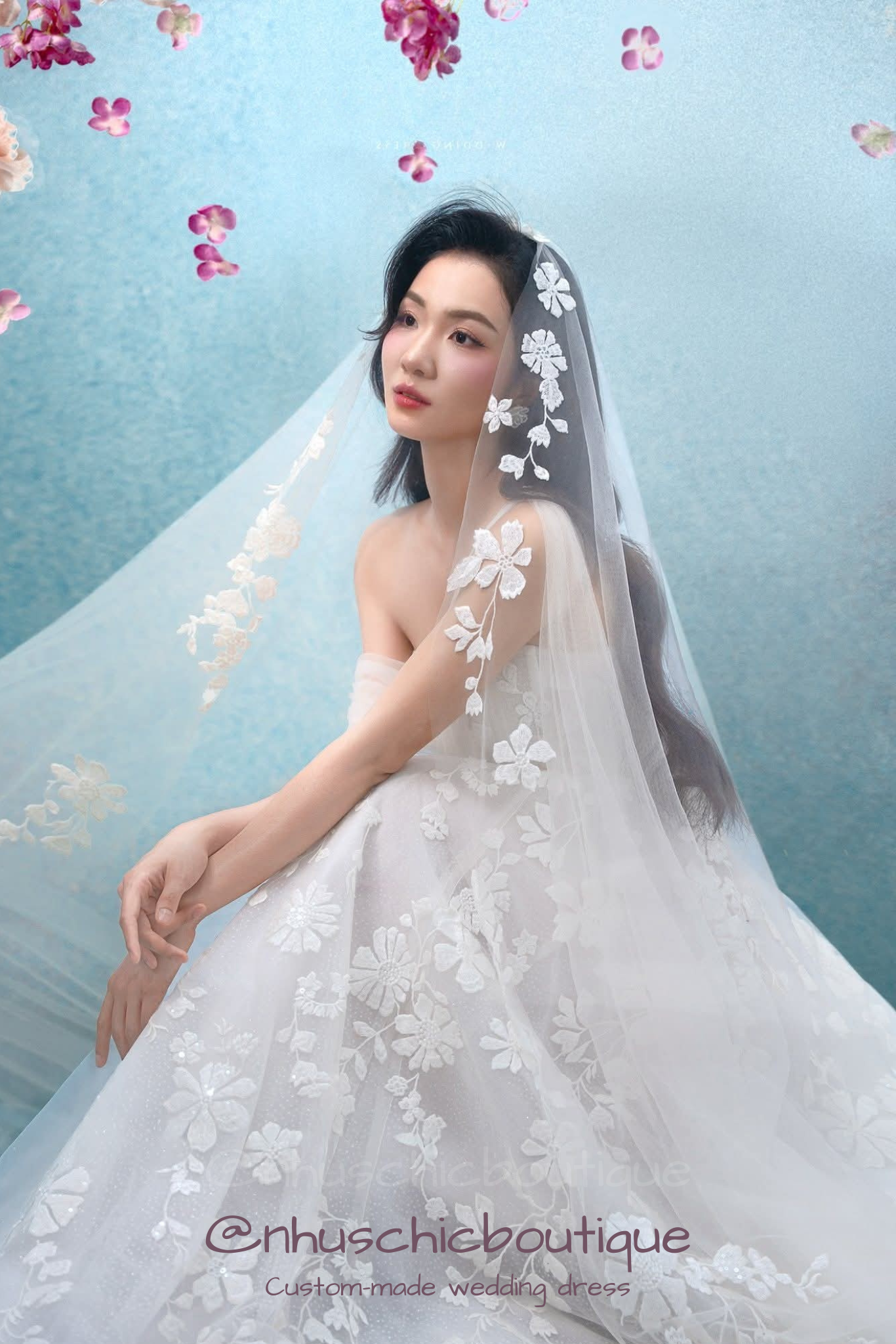 Close-up of bride in "Hana-Gasumi" floral appliqué wedding dress with a matching lace-trimmed veil.